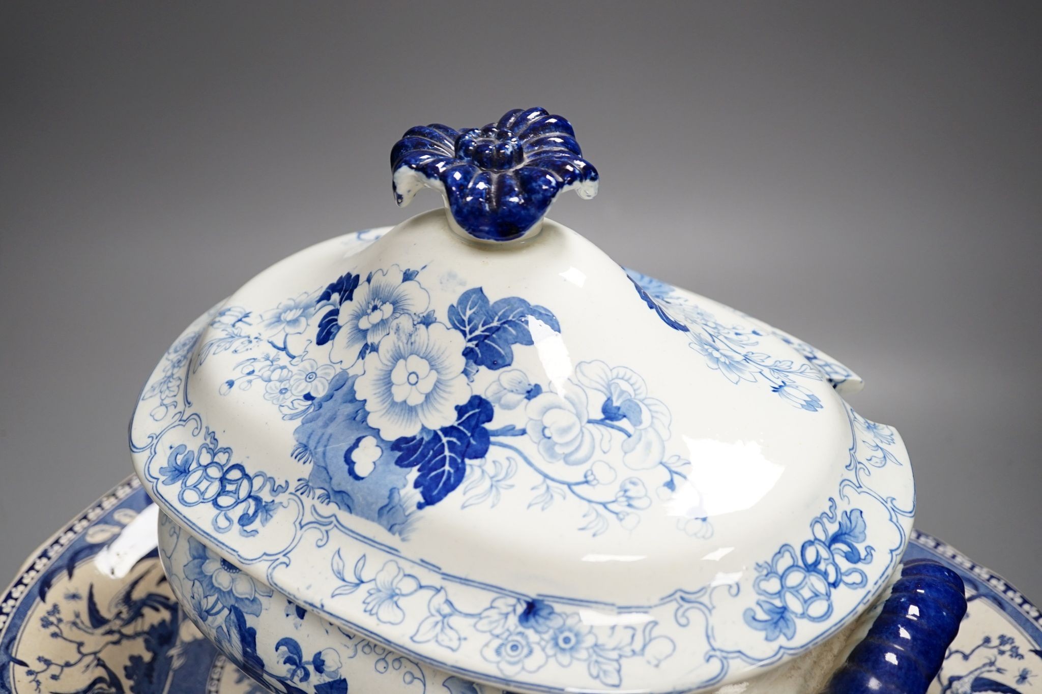 A Victorian Stone China soup tureen, 35cm wide, a Victorian blue-printed meat plate and a Masons Ironstone meat plate